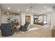 Spacious main bedroom with seating, book shelves, and bed at 781 Deer Clover Cir, Castle Pines, CO 80108