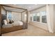 Bright main bedroom showcases a four-poster bed, large windows, and neutral carpet at 781 Deer Clover Cir, Castle Pines, CO 80108