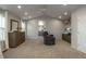 Expansive main bedroom with sitting area, dresser, and open doorway to the en-suite bathroom at 781 Deer Clover Cir, Castle Pines, CO 80108