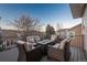 Cozy outdoor patio featuring a modern fire table and comfortable seating area, perfect for relaxation and entertaining at 781 Deer Clover Cir, Castle Pines, CO 80108