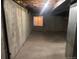 Unfinished basement with concrete walls, ceilings, and floor, and a small window at 4348 Sable St, Denver, CO 80239