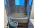 Bathroom featuring a marble tiled wall with a bathtub at 4348 Sable St, Denver, CO 80239