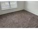 Neutral bedroom featuring carpet flooring and bright window at 4348 Sable St, Denver, CO 80239
