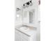 Bathroom vanity with large mirror and stylish light fixture at 24505 E Wagon Trail Ave, Aurora, CO 80016