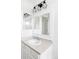 Bathroom vanity with large mirror and stylish light fixture at 24505 E Wagon Trail Ave, Aurora, CO 80016
