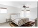 Well-lit bedroom with a comfortable bed, bedside table, and three windows at 24505 E Wagon Trail Ave, Aurora, CO 80016