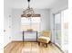 Cozy dining area with modern light fixture, adjacent to sliding glass doors at 24505 E Wagon Trail Ave, Aurora, CO 80016