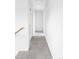 Clean hallway with carpet and natural light at 24505 E Wagon Trail Ave, Aurora, CO 80016