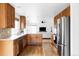 Modern kitchen with stainless steel appliances and hardwood flooring at 24505 E Wagon Trail Ave, Aurora, CO 80016