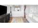 Open-concept living area with a view of the staircase and hardwood flooring at 24505 E Wagon Trail Ave, Aurora, CO 80016