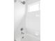 Clean shower and tub with white tile at 24505 E Wagon Trail Ave, Aurora, CO 80016