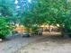 Charming backyard featuring mature trees, gravel, and backyard furniture set at 19156 E Arizona Pl, Aurora, CO 80017