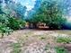 Large backyard with mature trees and a wooden fence, great for outdoor enjoyment at 19156 E Arizona Pl, Aurora, CO 80017