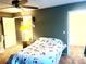 Inviting bedroom with floral bedding, multiple closets, and ample natural light at 19156 E Arizona Pl, Aurora, CO 80017