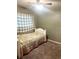 Cozy bedroom with neutral tones and plush carpeting at 19156 E Arizona Pl, Aurora, CO 80017