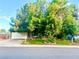 Charming home featuring a well-maintained front yard with mature trees and a two car garage at 19156 E Arizona Pl, Aurora, CO 80017