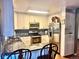 Well-equipped kitchen with stainless steel appliances and sleek granite counters at 19156 E Arizona Pl, Aurora, CO 80017