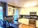 Stylish kitchen featuring granite counters, stainless steel appliances, and white cabinets at 19156 E Arizona Pl, Aurora, CO 80017
