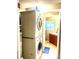 Convenient laundry room includes stacked washer/dryer and a utility sink at 19156 E Arizona Pl, Aurora, CO 80017