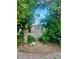 Backyard shed with a single window and door surrounded by lush greenery at 19156 E Arizona Pl, Aurora, CO 80017