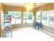 Bright sunroom featuring a pinball machine and views of the spacious backyard at 19156 E Arizona Pl, Aurora, CO 80017