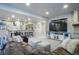 Open basement featuring a bar, living area with a fireplace, and comfortable furnishings at 17548 Colonial Park Dr, Monument, CO 80132