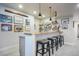 Finished basement bar with wooden countertop, pendant lights, and decorative wall art at 17548 Colonial Park Dr, Monument, CO 80132
