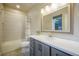 Bathroom with modern vanity, shower over tub, and neutral color palette at 17548 Colonial Park Dr, Monument, CO 80132