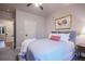 Comfortable bedroom featuring soft natural light, neutral decor, and ample closet space at 17548 Colonial Park Dr, Monument, CO 80132