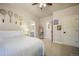 Bright bedroom with neutral colors, ensuite bathroom, and charming decor at 17548 Colonial Park Dr, Monument, CO 80132