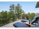 Relaxing deck with lounge chairs, a table, and scenic views at 17548 Colonial Park Dr, Monument, CO 80132