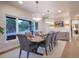 Bright dining room boasts a large window, elegant lighting, and a spacious layout perfect for entertaining at 17548 Colonial Park Dr, Monument, CO 80132