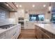 Well-equipped kitchen with modern appliances, custom cabinets, and ample counter space at 17548 Colonial Park Dr, Monument, CO 80132