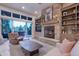 Bright living room with sliding glass doors, comfortable seating, fireplace, and access to the outdoor deck at 17548 Colonial Park Dr, Monument, CO 80132