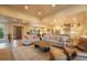 Bright and airy living room seamlessly connects to the kitchen and dining area, perfect for entertaining and everyday living at 17548 Colonial Park Dr, Monument, CO 80132
