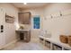 This mud room features built in shelving, storage cubbies, and a bench, perfect for organization at 17548 Colonial Park Dr, Monument, CO 80132