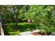 Serene backyard featuring manicured lawn, privacy fence and a stone paver walkway at 1519 16Th St, Boulder, CO 80302