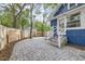 Stone paver patio area, featuring a newly constructed wooden fence, with access to the house at 1519 16Th St, Boulder, CO 80302