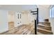 Finished basement space with wood floors, recessed lighting, and staircase at 1519 16Th St, Boulder, CO 80302