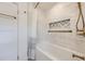 Clean bathroom featuring white subway tile, bathtub and gold shower fixtures at 1519 16Th St, Boulder, CO 80302