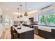 Bright kitchen featuring a breakfast bar island, stainless steel appliances, and a white farmhouse sink at 1519 16Th St, Boulder, CO 80302