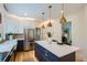 Spacious kitchen showcasing white cabinets, stainless steel appliances, and a stylish center island at 1519 16Th St, Boulder, CO 80302