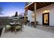 Relaxing back patio with outdoor dining and grill, perfect for entertaining guests and enjoying outdoor living at 2948 S Clarkson St, Englewood, CO 80113