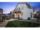 Exterior of home with a backyard featuring a patio, grilling area, and upper balcony at 2948 S Clarkson St, Englewood, CO 80113