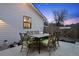 Cozy backyard patio with seating and a dining table set against the twilight sky at 2948 S Clarkson St, Englewood, CO 80113
