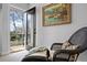 Cozy seating area opens to a private balcony with an artistic accent wall at 2948 S Clarkson St, Englewood, CO 80113