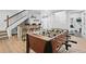 Basement featuring a foosball table, custom bar with barstool seating, and access to workout room at 2948 S Clarkson St, Englewood, CO 80113