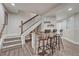 Finished basement with stairs, a wood look floor and a bar with seating at 2948 S Clarkson St, Englewood, CO 80113