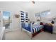 bedroom with striped bedding, access to outdoor balcony, and a playful vibe at 2948 S Clarkson St, Englewood, CO 80113