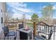 Outdoor deck with a fire pit, seating and views of mature landscaping and neighborhood at 2948 S Clarkson St, Englewood, CO 80113